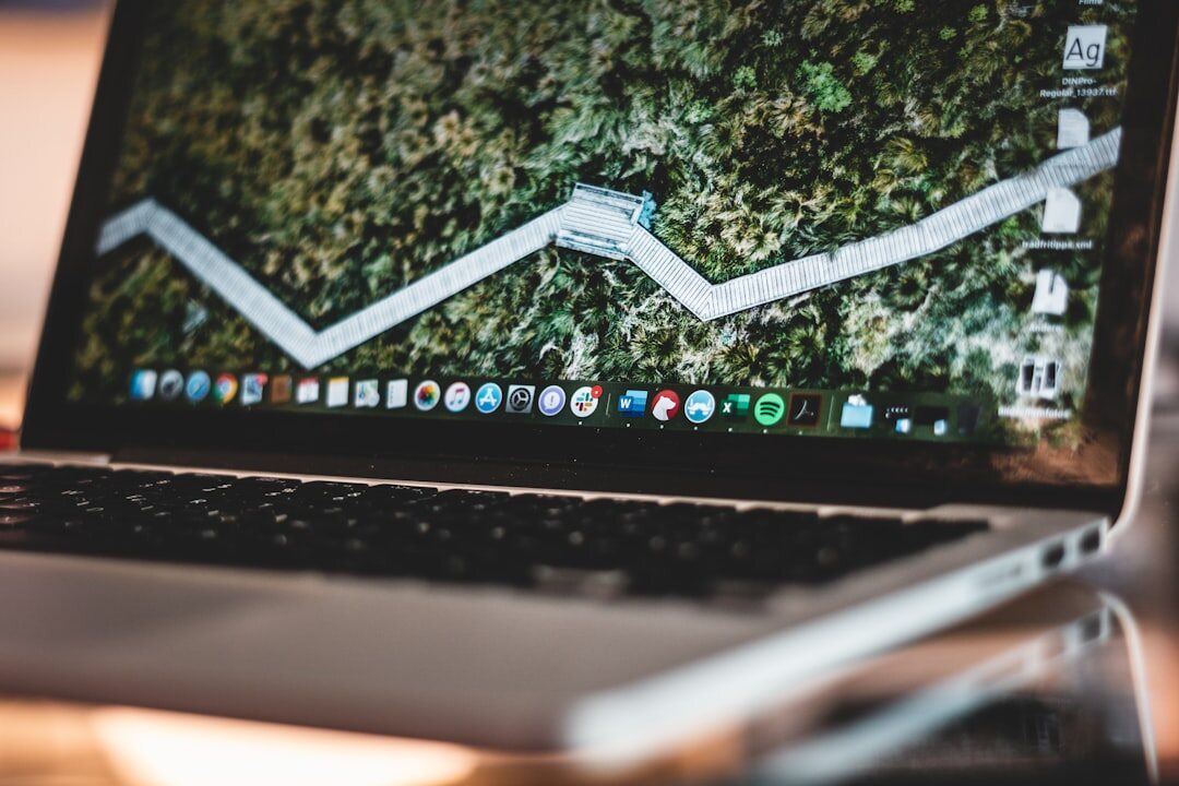 Data analytics dashboard on a laptop screen with colorful charts and graphs